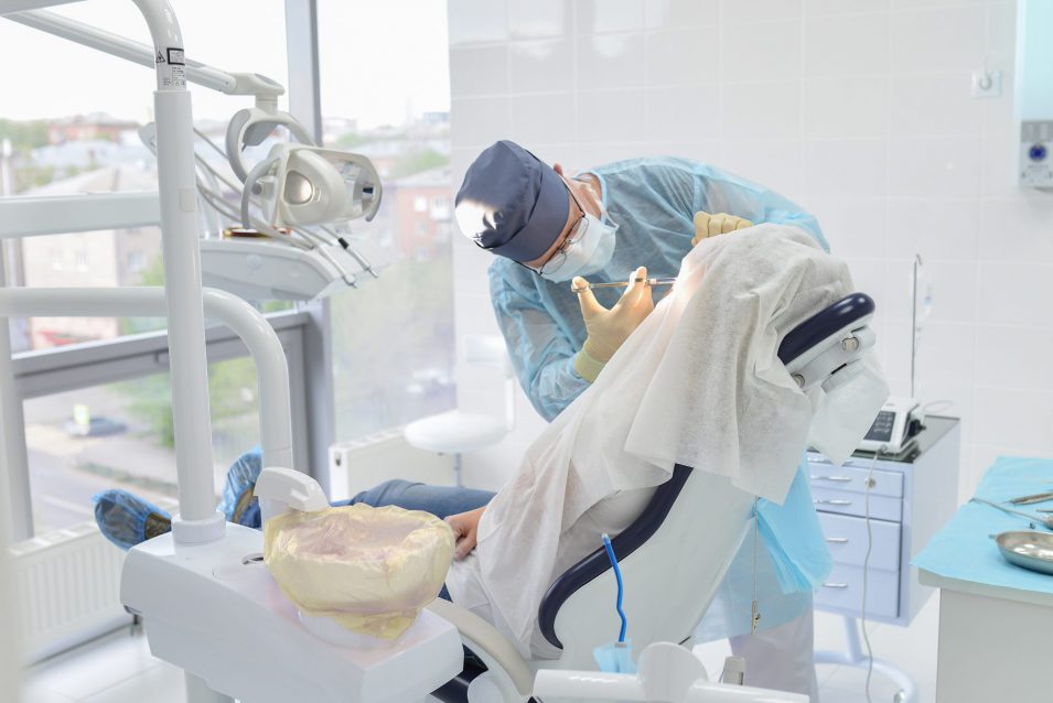 Kitchener emergency dentist performs dental surgery
